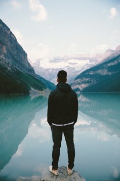 Young man looking at the lake
