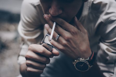 Addict smoking a cigarette
